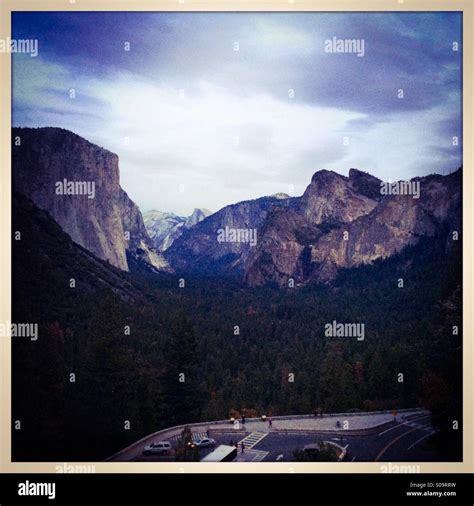 Tourists Look At Yosemite Valley From The Famous Tunnel View Vista On