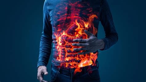 Burning Stomach Pain Man Holding His Stomach With Fire Inside Concept