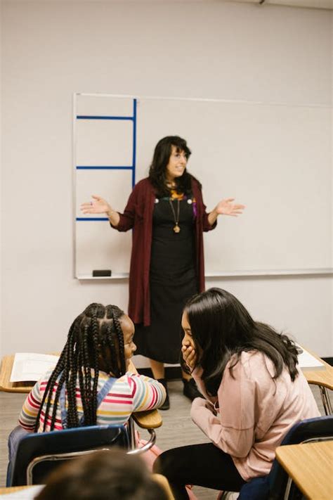 Two Students Talking to Each Other · Free Stock Photo