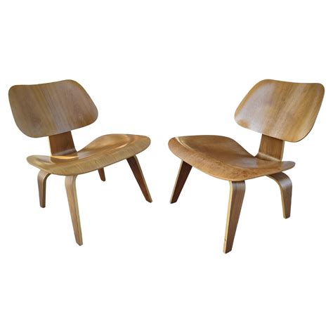 Pair Of Charles And Ray Eames Lcw Walnut Lounge Chairs By Herman Miller