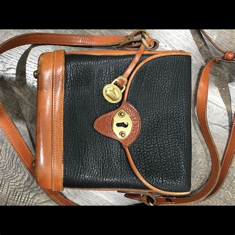 Dooney Bourke Crossbody Black And Tan Purse In Tan Purse