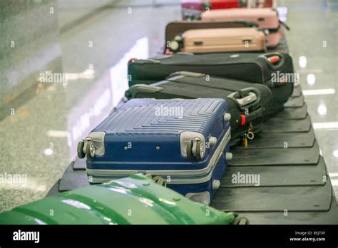 Suitcases on Baggage Claim Conveyor Belt at Airport Stock Photo - Alamy