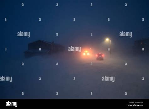 Street in the hurricane during the polar night, Nybyen, Longyearbyen ...