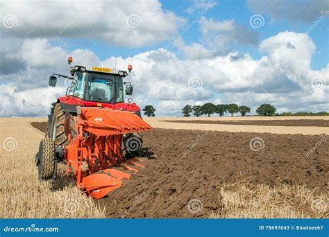 Modern Massey Ferguson Tractor Pulling A Plough Editorial Stock Photo