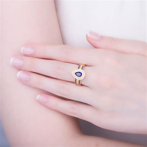 Fusion Sapphire Pear 18k Yellow Gold Moissanite Halo Engagement Ring