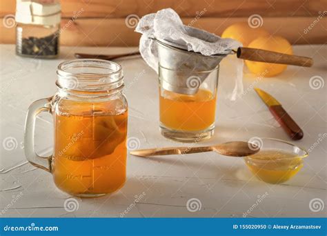 Homemade Fermented Drink Kombucha In Glass Jars With Lemon Honey And