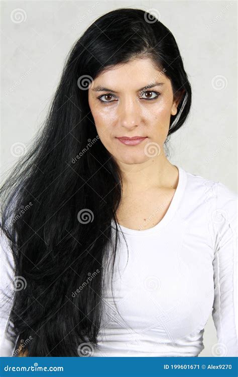 Beautiful Woman With Long Black Hair And Penetrating Look Stock Image