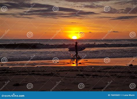 Surfers on the Beach of Santa Teresa at Sunset / Costa Rica Stock Image ...