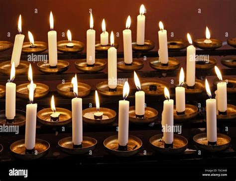 Burning candles in a church Stock Photo - Alamy