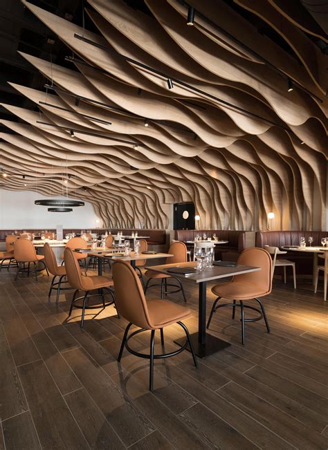 Sculptural Wood Fins Create An Eye Catching Interior For This Restaurant