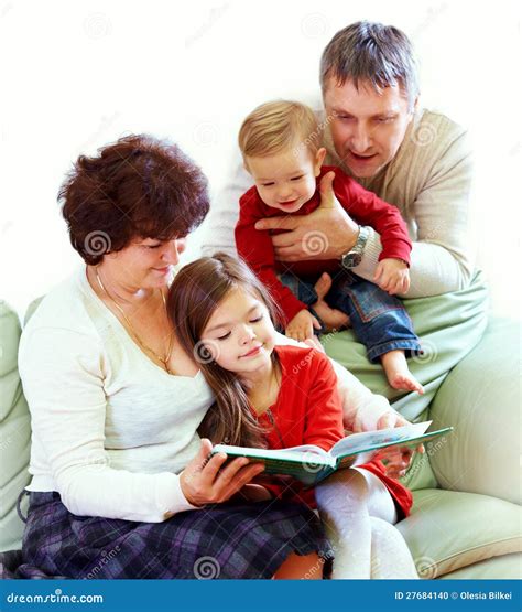 Grandparents Reading Books To Grandchildren Stock Photo - Image: 27684140