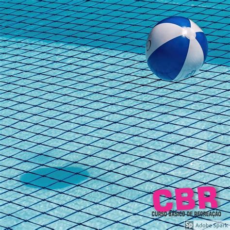 A Blue And White Beach Ball Floating On Top Of A Swimming Pool Netted