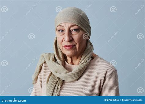 Mature Bald Woman Wearing Headscarf Looking At Camera Stock Image