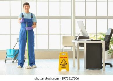 Male Janitor Mopping Floor Office Stock Photo 1973517806 Shutterstock