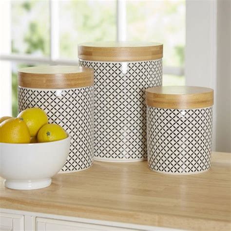 Three Containers With Lemons And Two Lemons In Them Sitting On A