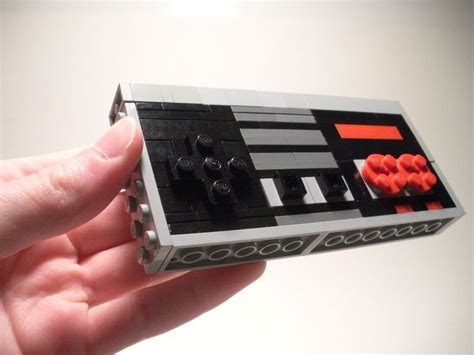 A Hand Is Holding A Lego Star Wars Set