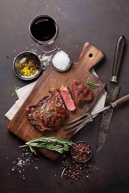 Premium Photo Grilled Ribeye Beef Steak With Red Wine Herbs And Spices