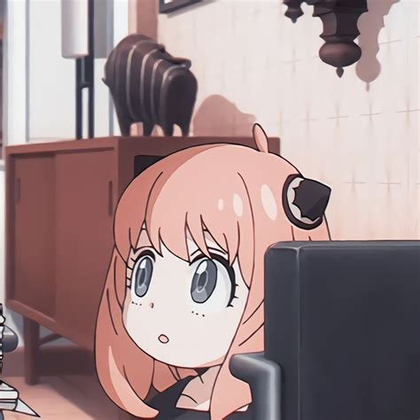 An Anime Girl With Long Pink Hair Sitting In Front Of A Computer