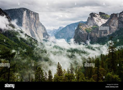 Yosemite Valley With Half Dome On The Left With Waterfall And Fog In