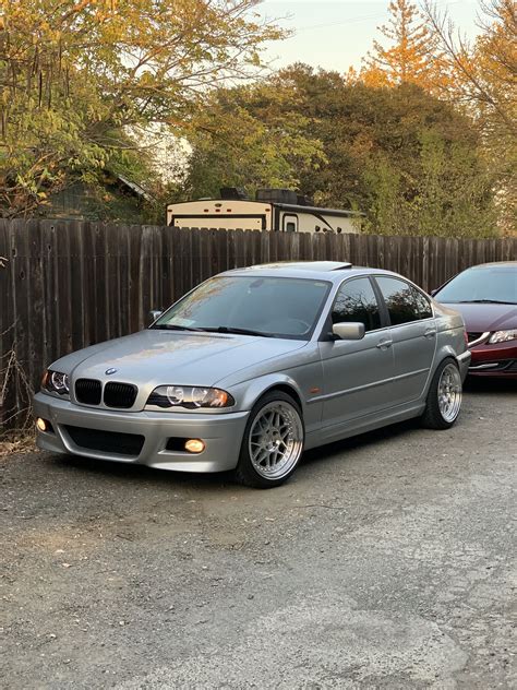 Bmw E46 Sedan Two Cars Parked Near A Fence