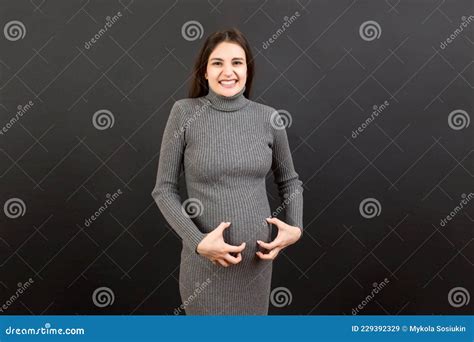 Pregnant Woman Scratching Her Belly On Colored Background Stock Image