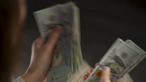 Woman Counting Us Dollar Bills Or Paying In Cash Stock Video