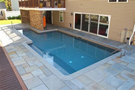 Awesome custom pool in Connecticut. Custom design next to home with ...