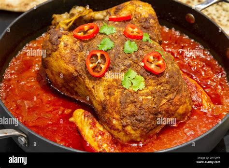 One Pot Spiced Roast Chicken With Garnish Stock Photo Alamy