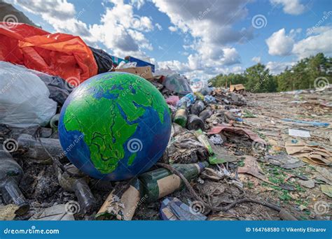 Landscape Planet Earth In Landfill Concept Of Environment Pollution By