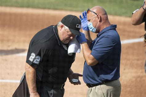 Watch: Umpire Joe West briefly exits Jays-Nats game after being hit by flying bat - UPI.com