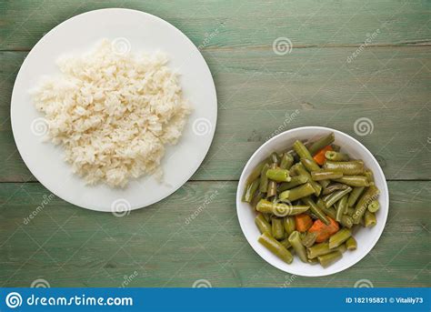 White Rice On A White Plate Rice On A Coloted Background Top View