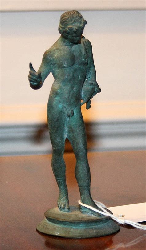 Lot A Mid 19th Century Miniature Bronze Figure Of A Naked Youth In