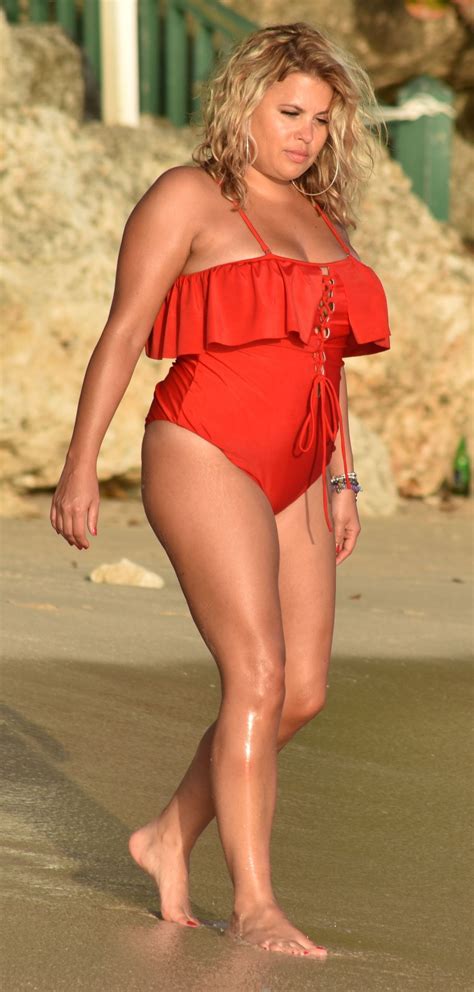 Nadia Essex In A Red Swimsuit Enjoying The Sun Sand And Sea In Barbados