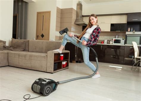 Premium Photo Young Funny Woman With Vacuum Cleaner Fooling Around