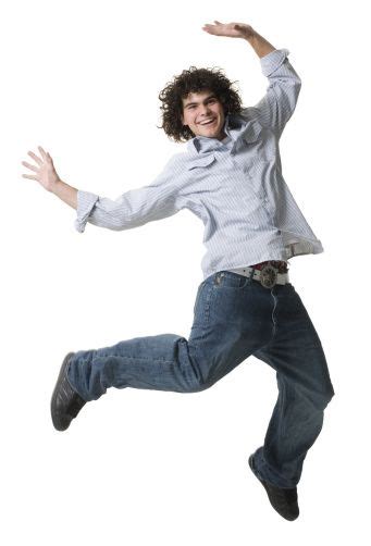 A Man Jumping In The Air With His Arms Outstretched