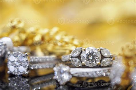 Luxury gold Jewelry diamond rings with reflection on black background ...