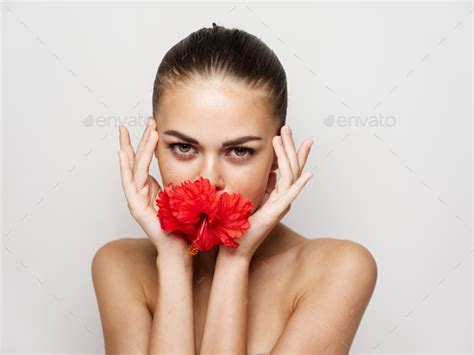 Pretty Woman Attractive Look Naked Shoulders Red Flower In Mouth Stock