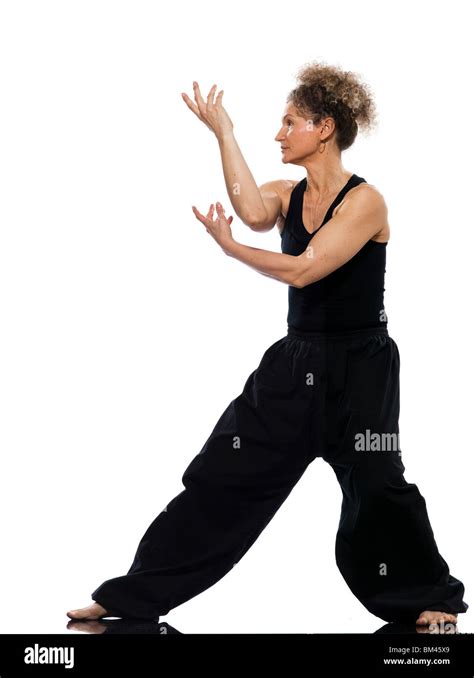 Mature Woman Praticing Tai Chi Chuan In Studio On Isolated White Background Stock Photo Alamy