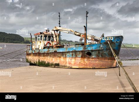 An Old Rusty Boat On The Beach Of A River Stock Photo Alamy