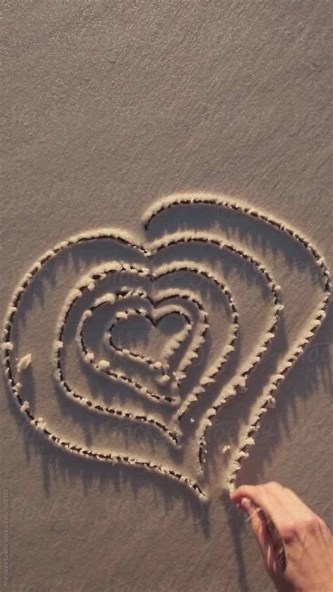 "Drawing Heart In Beach Sand" by Stocksy Contributor "Maryanne Gobble ...