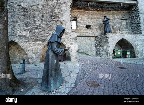 Faceless Monk Statue In Danish Garden Of Old Town Holding Hands In