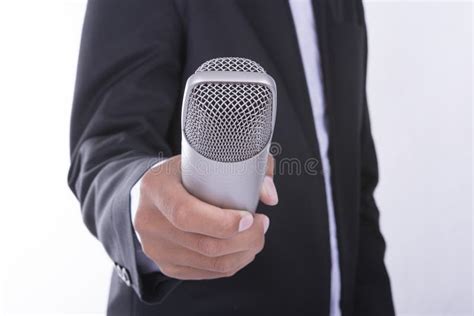 Man In Business Suit Holding Microphone Interview Concept Stock Photo