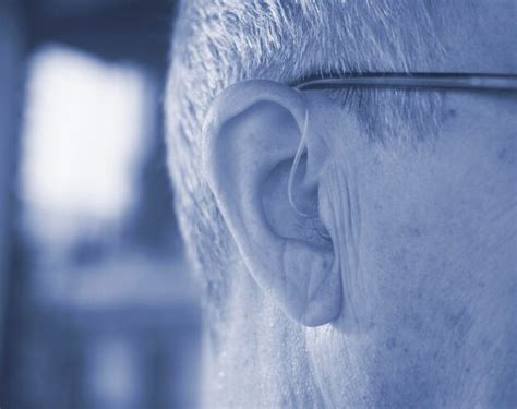 Premium Photo Close Up Of Man Wearing Hearing Aid