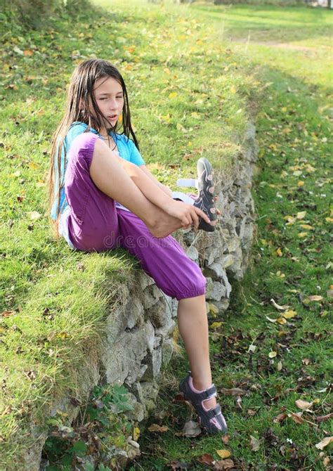 Kid Girl Putting On Shoes On Swing Stock Photo Image Of Cute Grass