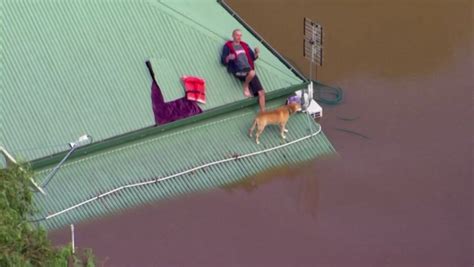 Australians Cling To Rooftops During Worst Flood On Record Video