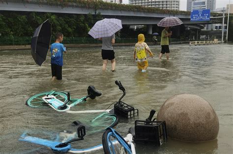 Rain Pelts Beijing Northern China Causing Floods And Claiming At