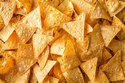 Nacho texture heap of crunchy mexican chips as delicious background ...
