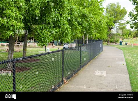 Path And Fence Enclosing Picnic Area In Heather Farms Park A Public