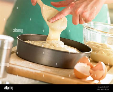 Pouring Cake Mixture Into Baking Tin Stock Photo Alamy