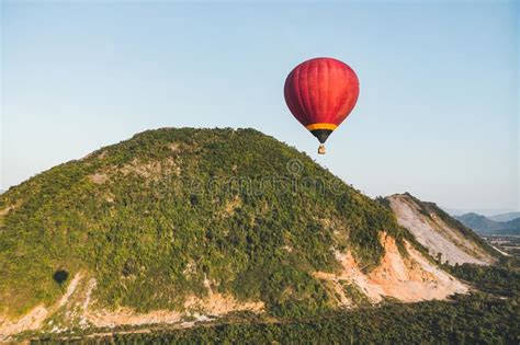 Hot Air Balloons Flying Over Mountain And Green Rice Field In Vang